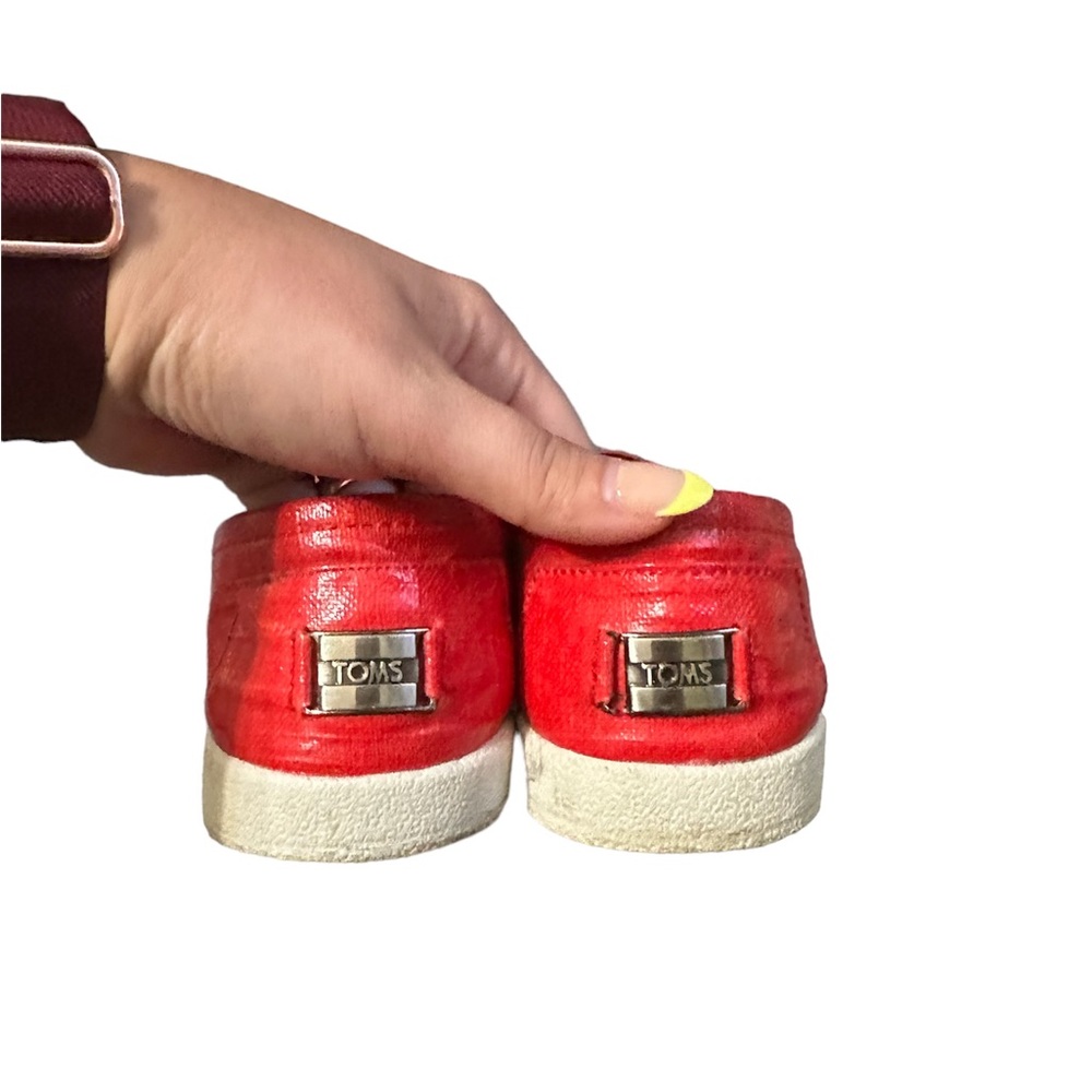 Red Tom’s slip-ons